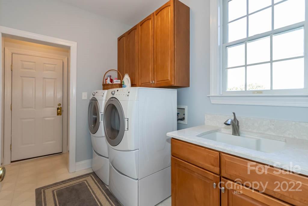 1629 Stevens Ridge Road Matthews, NC 28105 - Photo 39 of 39 a utility room with dryer and washer