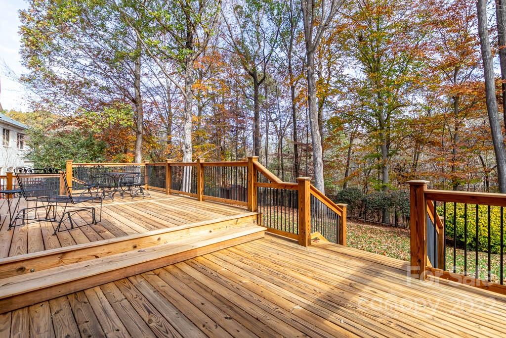 1629 Stevens Ridge Road Matthews, NC 28105 - Photo 8 of 39 a view of a house with wooden deck next to a yard