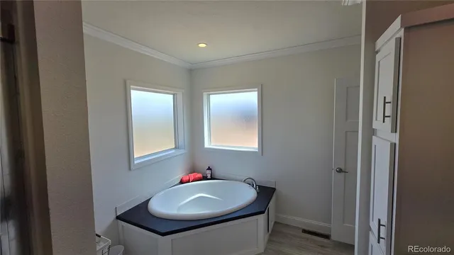 a bathroom with a sink toilet and a mirror