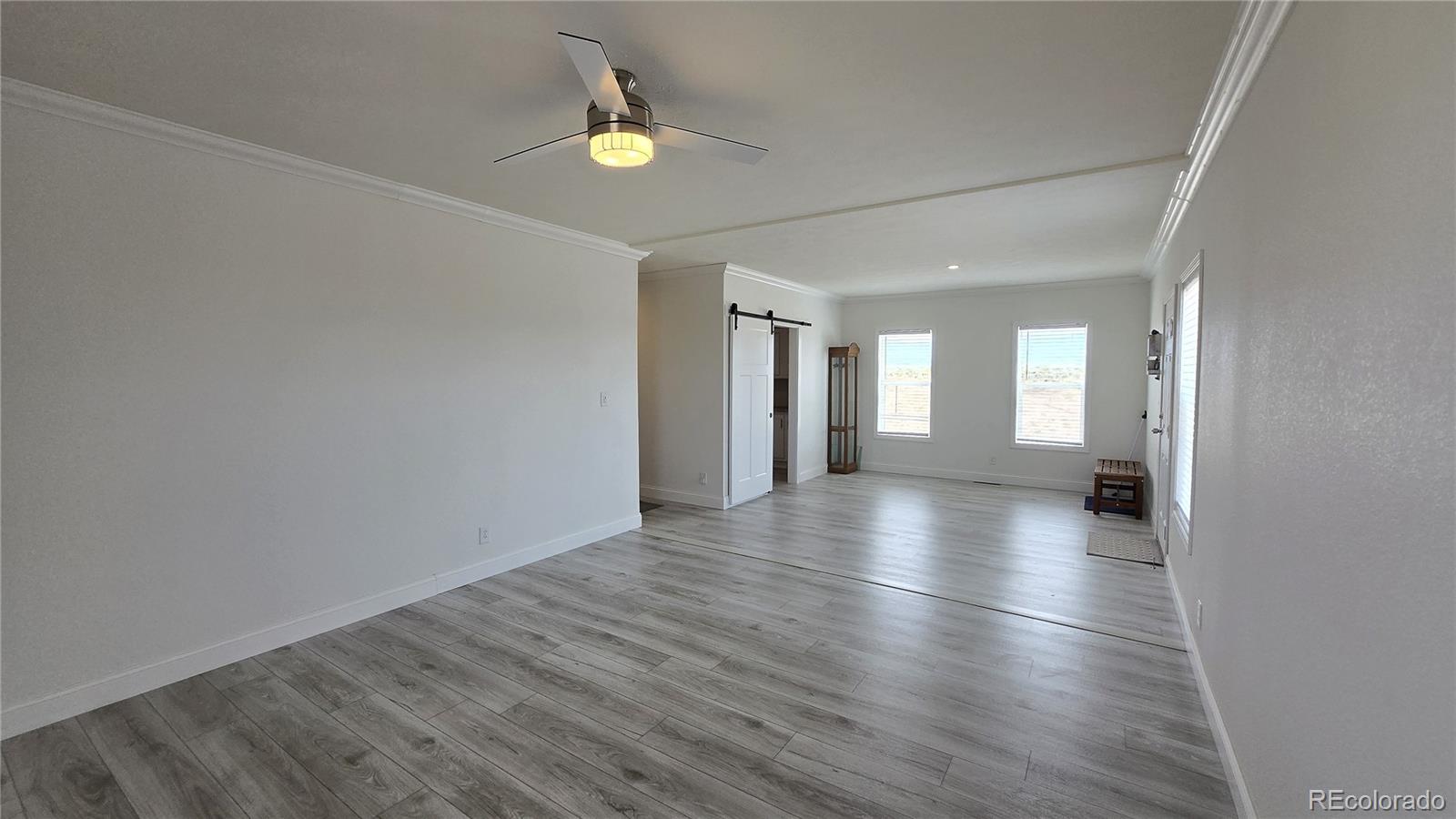 16383 Peacock Road Sanford, CO 81151 - Photo 15 of 33 a view of livingroom and kitchen with wooden floor