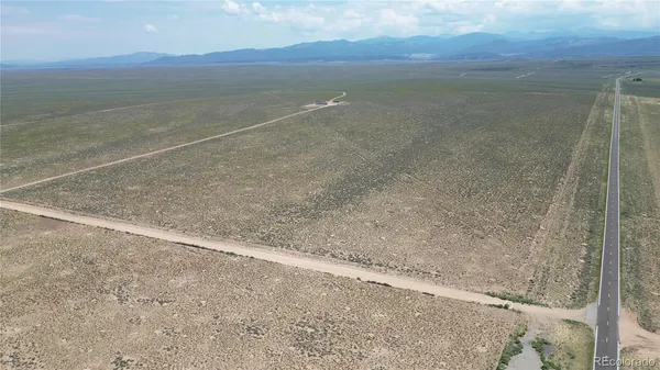 a view of an ocean beach and mountain