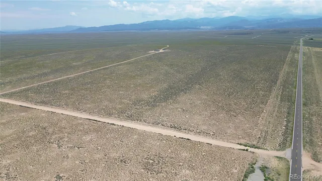 a view of an ocean beach and mountain