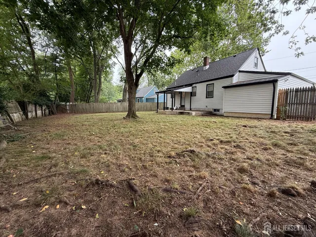 a house that has a tree in front of it