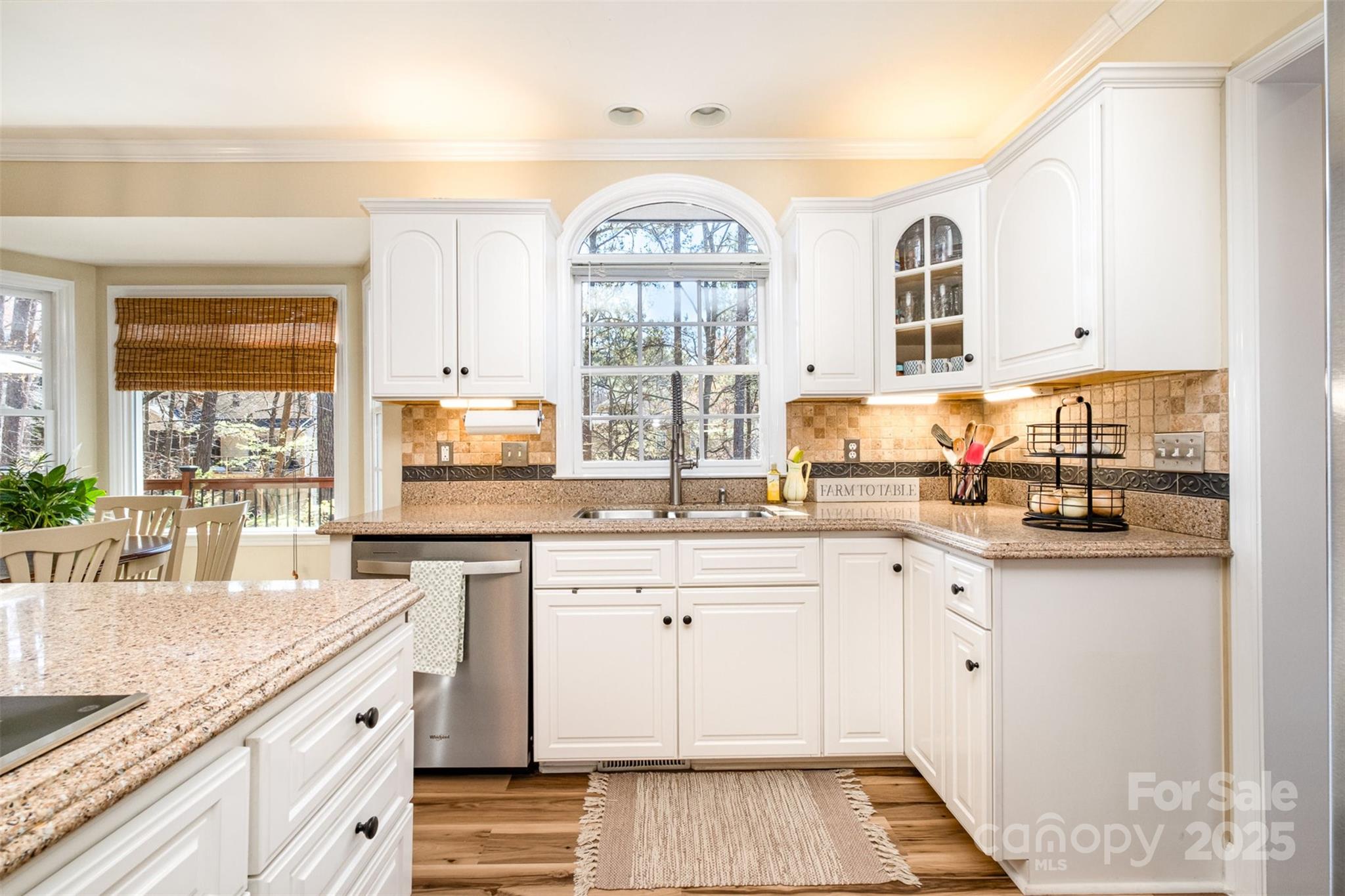 11122 Windgate Court Tega Cay, SC 29708 - Photo 11 of 48 a kitchen with stainless steel appliances granite countertop a stove and a sink