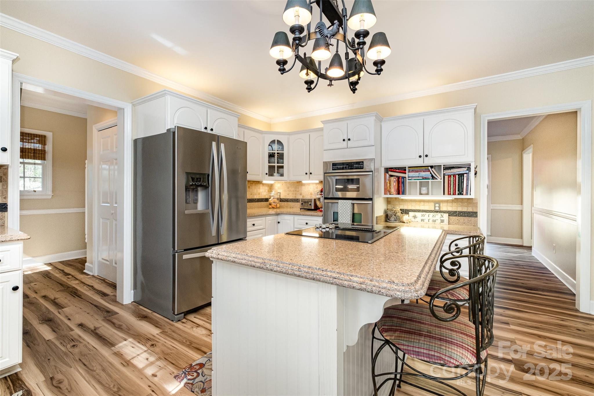 11122 Windgate Court Tega Cay, SC 29708 - Photo 12 of 48 a kitchen with stainless steel appliances granite countertop a sink refrigerator and microwave