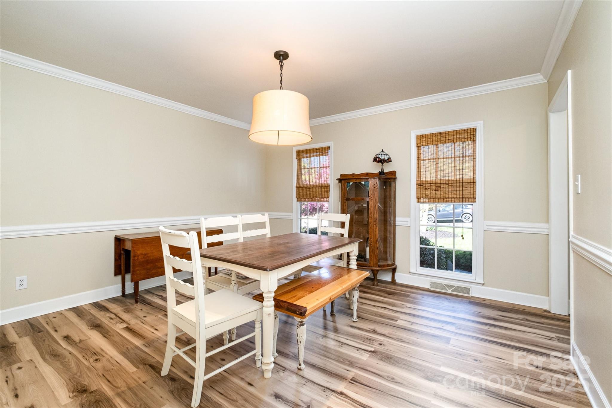 11122 Windgate Court Tega Cay, SC 29708 - Photo 7 of 48 a view of a dining room with furniture window and wooden floor