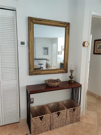 a living room with a couch and a dresser