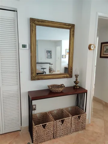 a living room with a couch and a dresser