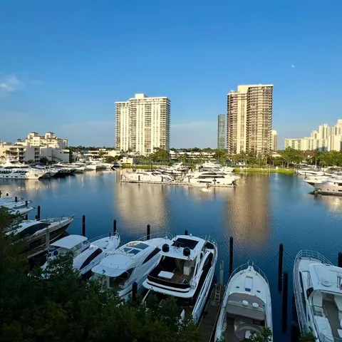 a view of a lake with tall buildings