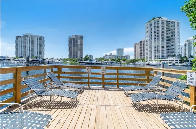 a view of a balcony with two chairs and a table