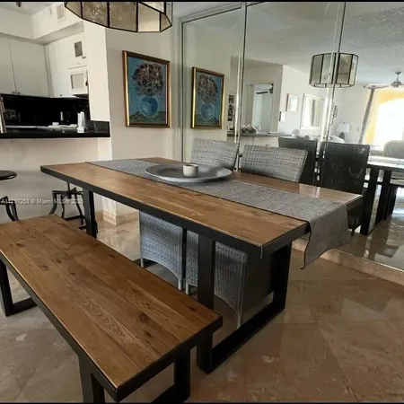 a kitchen with a stove a sink and a refrigerator