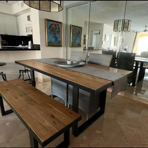 a kitchen with a stove a sink and a refrigerator