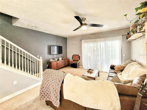 a bedroom with furniture a bed and a chandelier