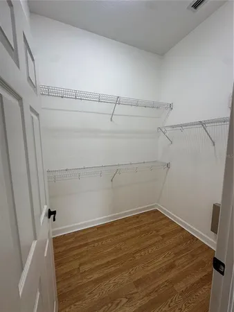 a view of a room with racks on the wall