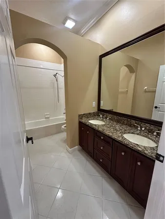 a bath room with a sink and a mirror