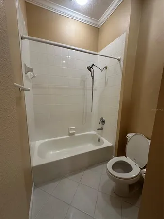 a bathroom with a toilet a sink and bathtub