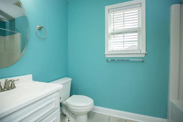a bathroom with a toilet and a sink
