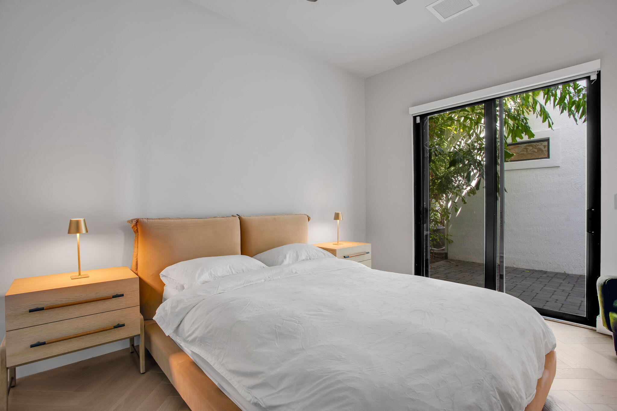 6903 Northwest 28th Avenue Boca Raton, FL 33496 - Photo 30 of 69 a bedroom with a bed and a window
