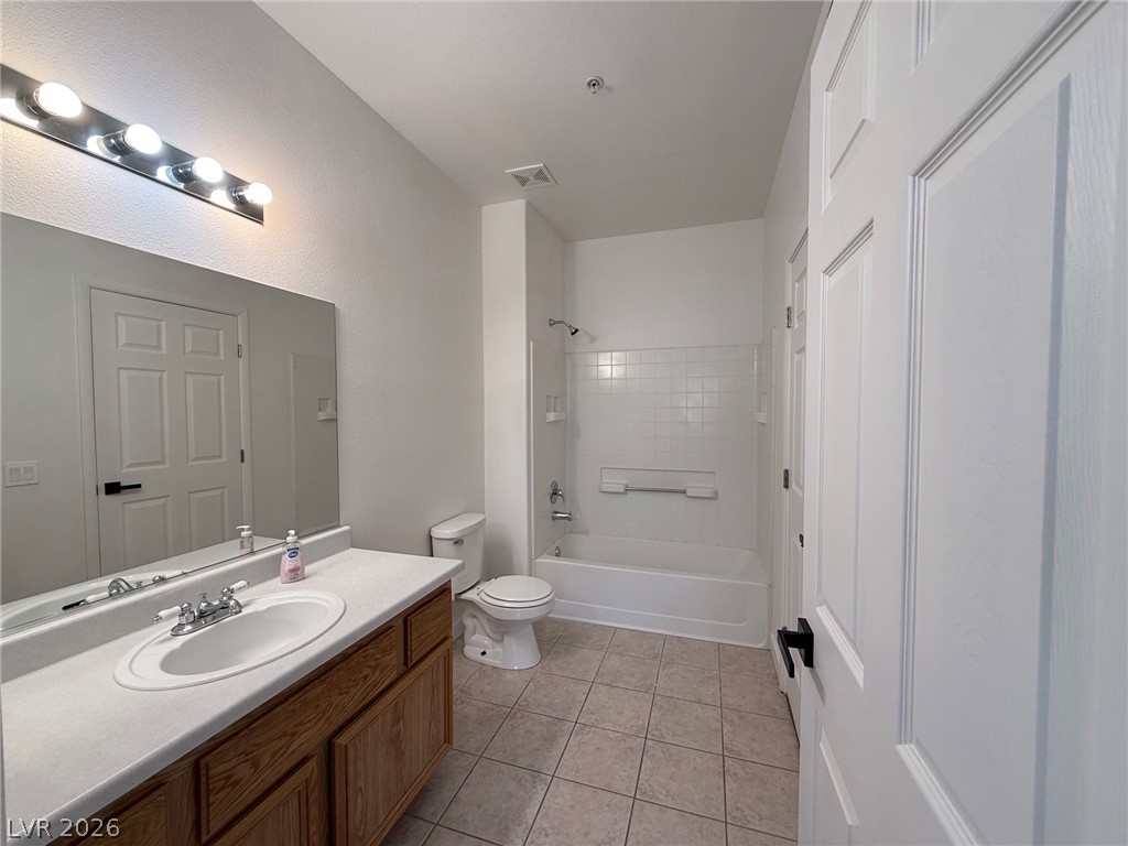 9050 West Warm Springs Road, Unit 2002 Las Vegas, NV 89148 - Photo 34 of 46 This bright bathroom offers a clean aesthetic with practical fixtures and a refreshing ambiance.