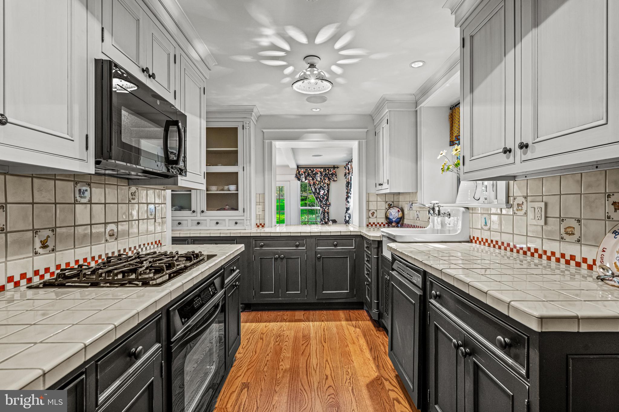 770 Godfrey Road Villanova, PA 19085 - Photo 102 of 150 a kitchen with a stove a sink and a refrigerator