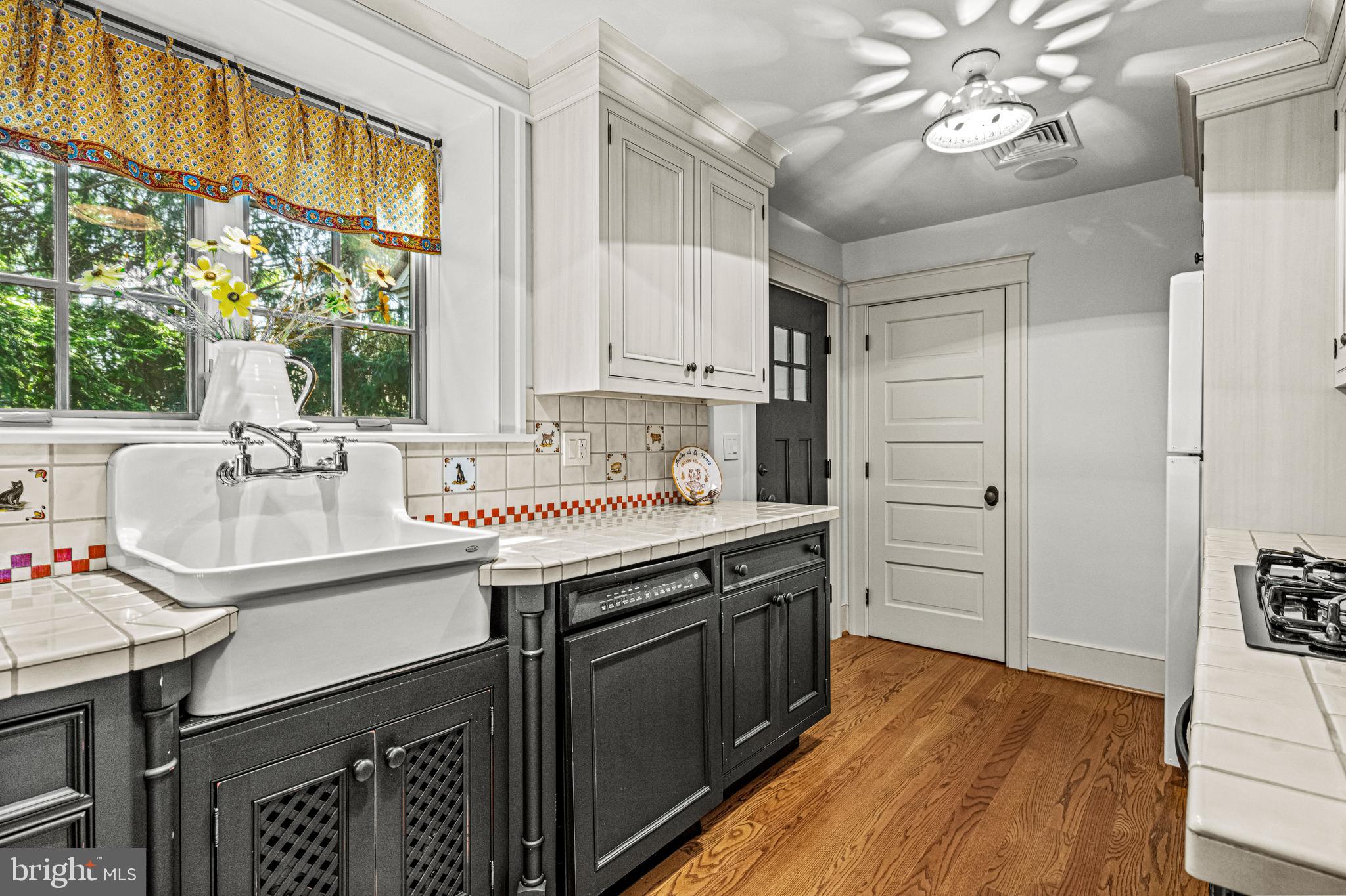 770 Godfrey Road Villanova, PA 19085 - Photo 103 of 150 a kitchen with granite countertop a sink appliances cabinets and a large window