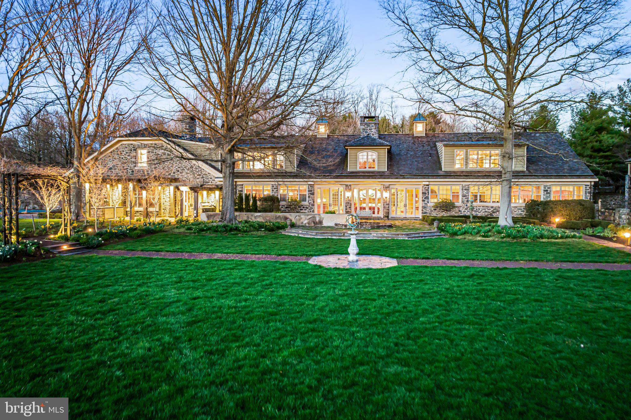 770 Godfrey Road Villanova, PA 19085 - Photo 11 of 150 a front view of a building with garden and trees