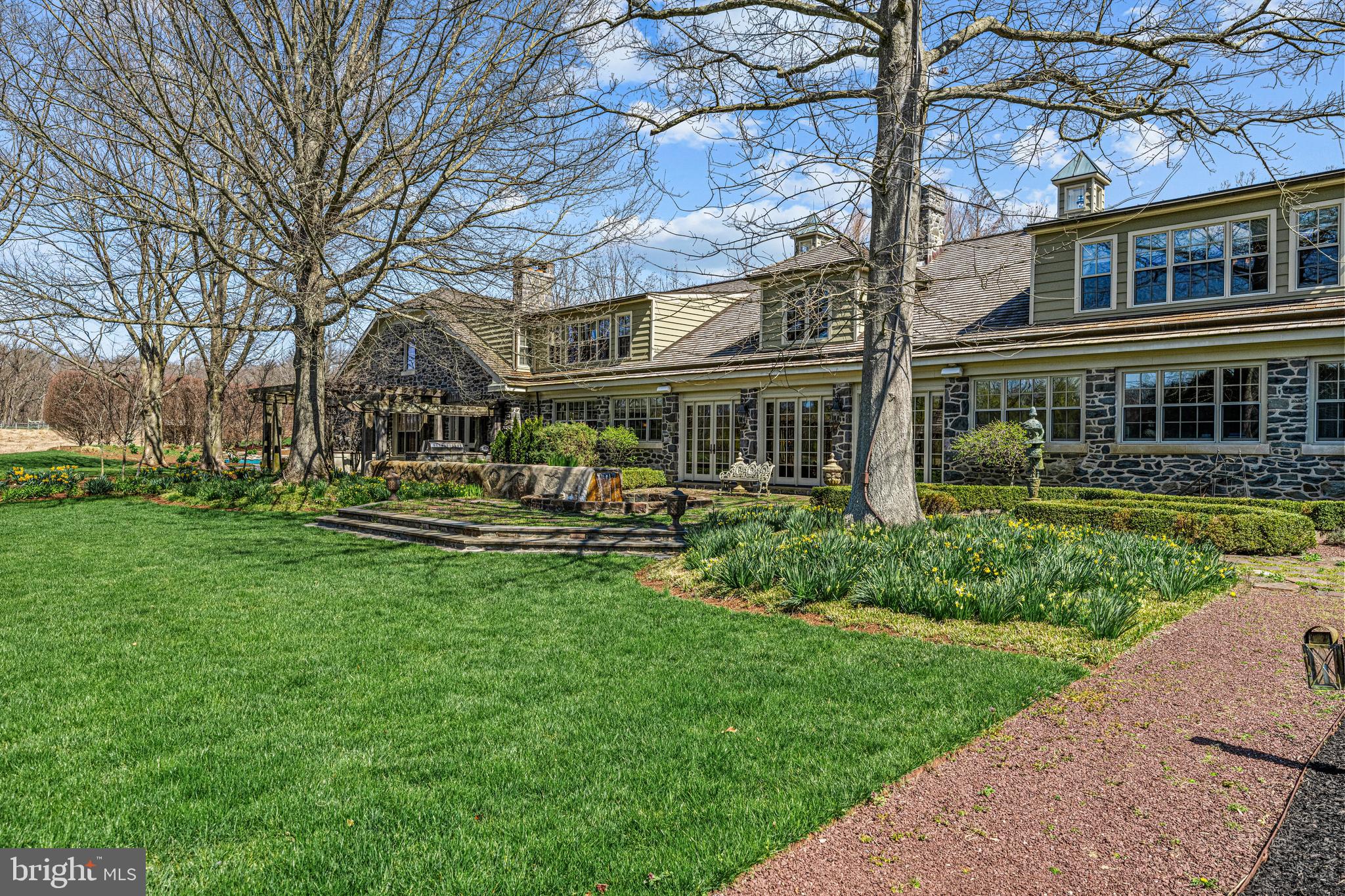 770 Godfrey Road Villanova, PA 19085 - Photo 127 of 150 a front view of a house with garden and trees