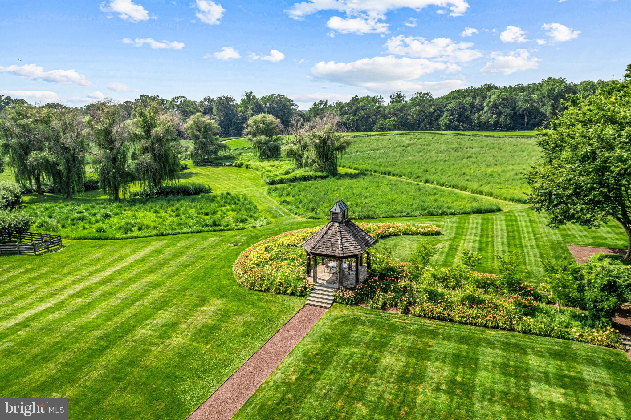 770 Godfrey Road Villanova, PA 19085 - Photo 134 of 150 a view of a golf course with a lake