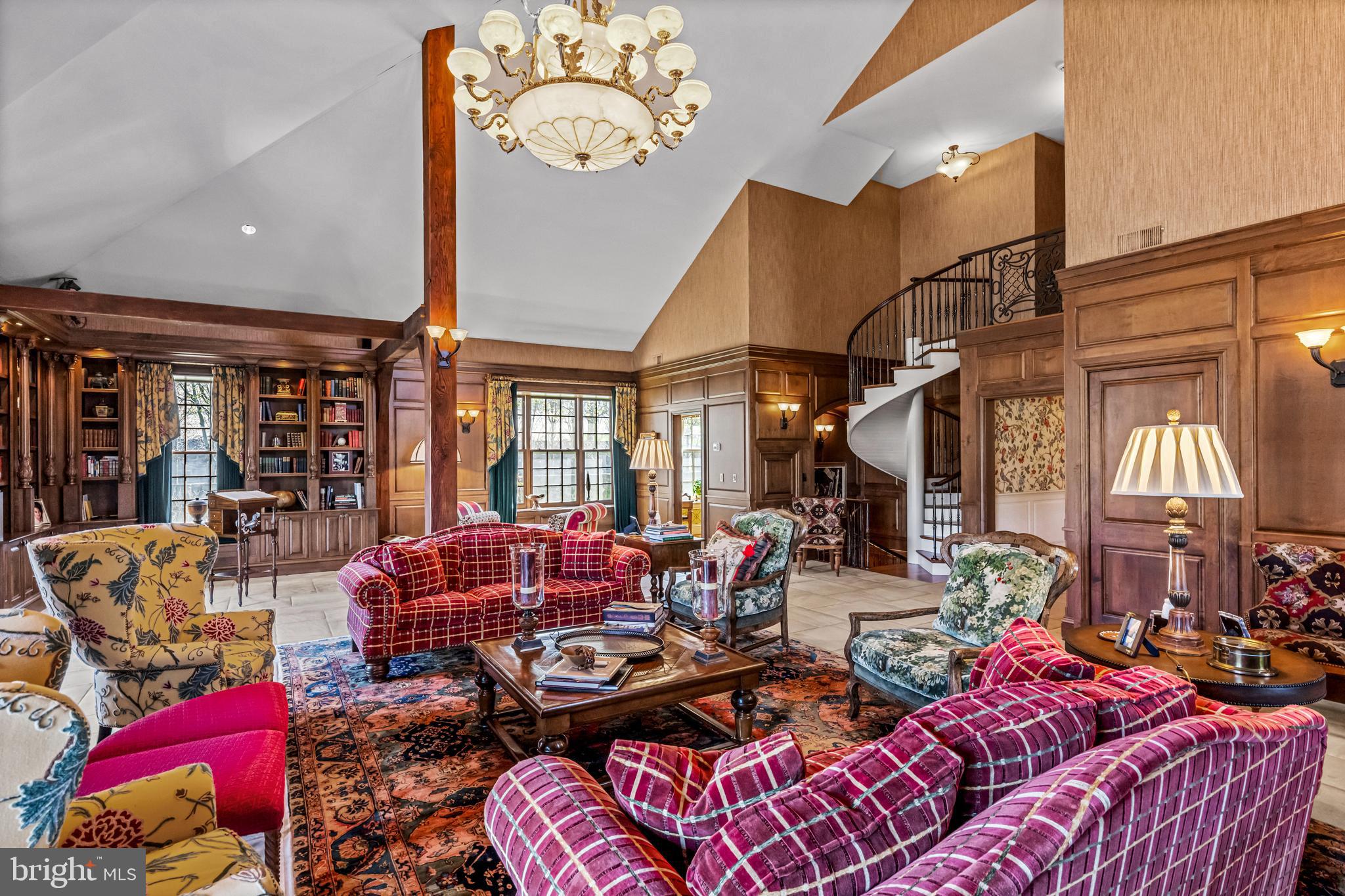 770 Godfrey Road Villanova, PA 19085 - Photo 33 of 150 a living room with furniture a chandelier and a large window