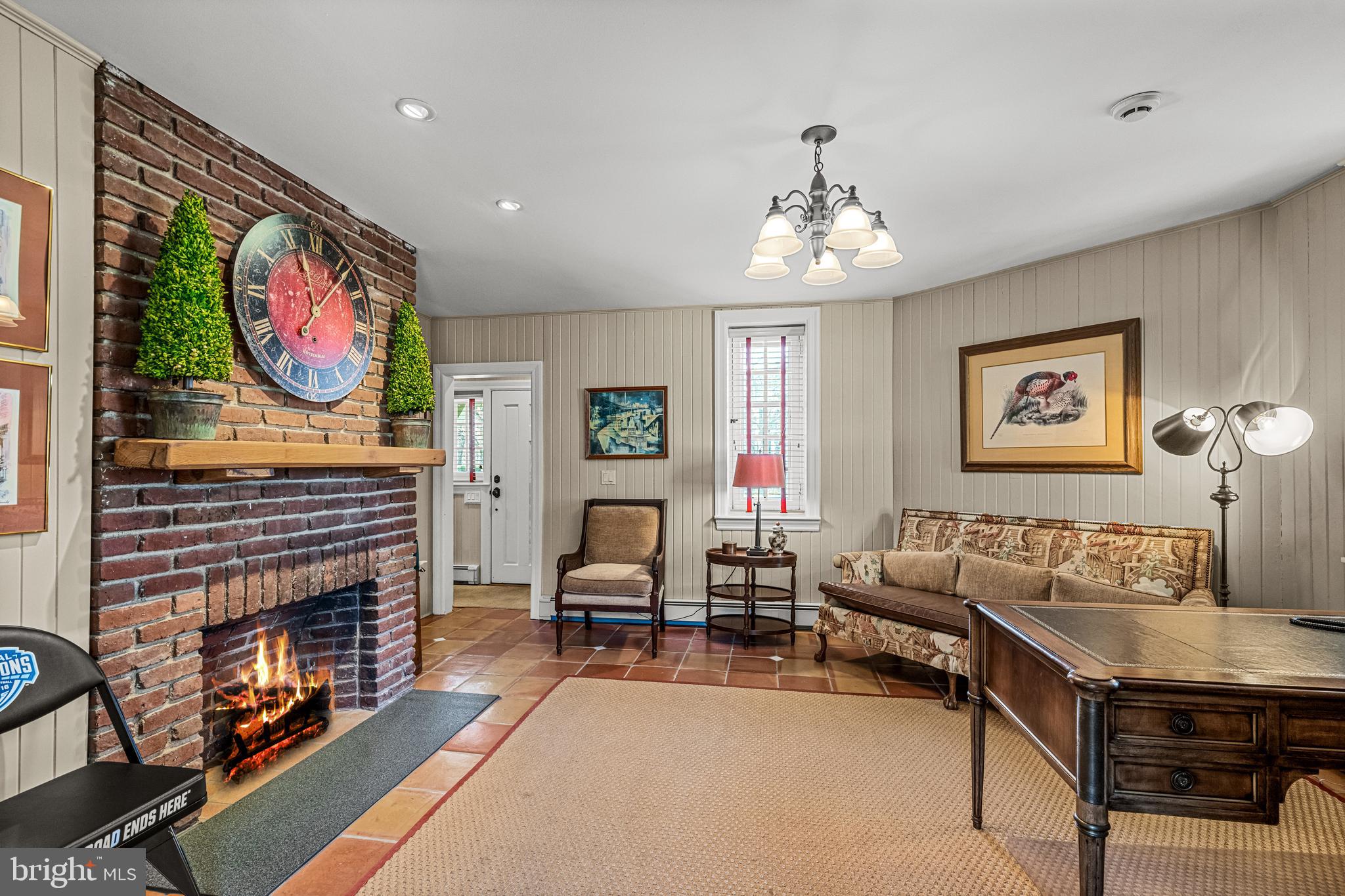770 Godfrey Road Villanova, PA 19085 - Photo 84 of 150 a living room with furniture a fireplace and a flat screen tv