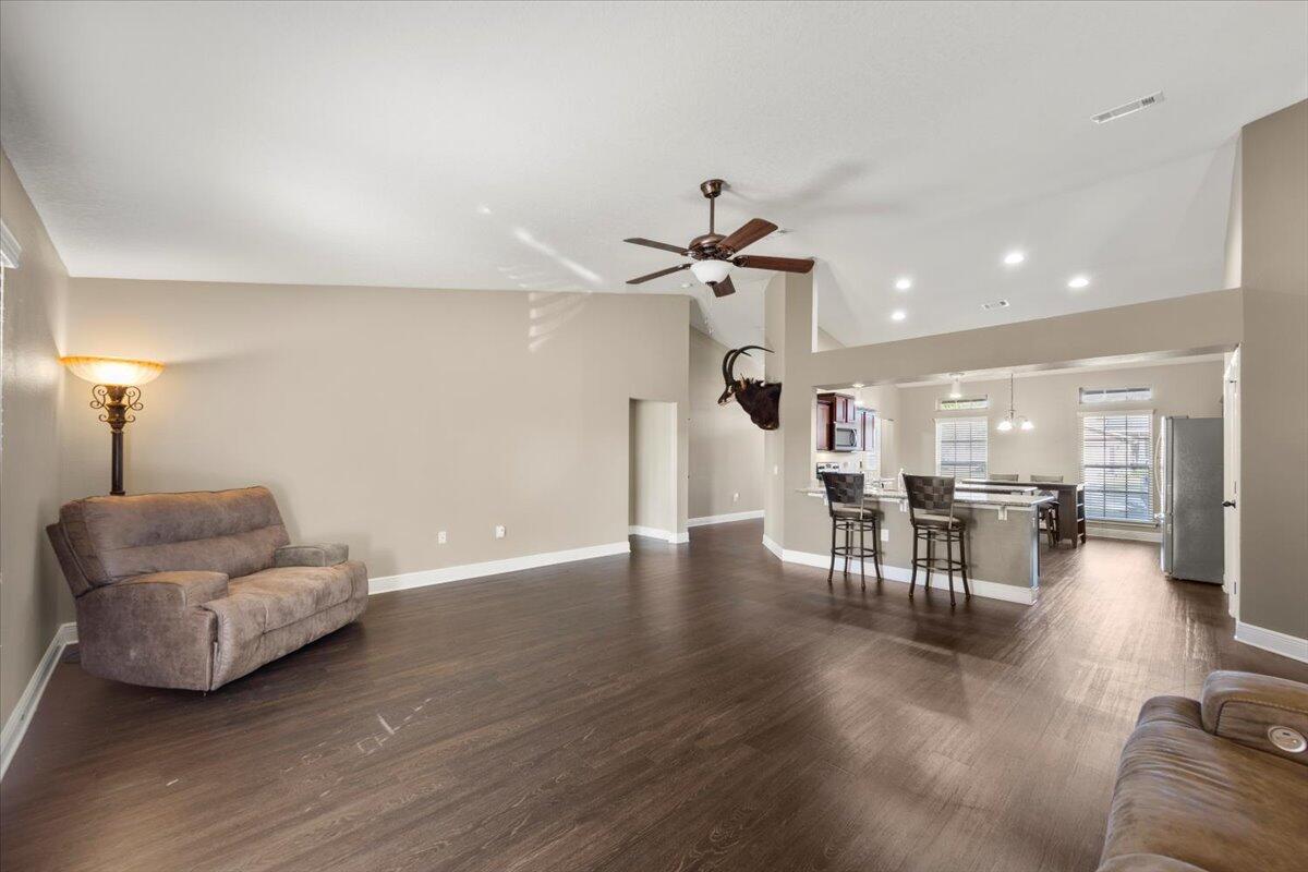 5755 Stream Mill Way Pace, FL 32571 - Photo 11 of 29 a living room with furniture and wooden floor