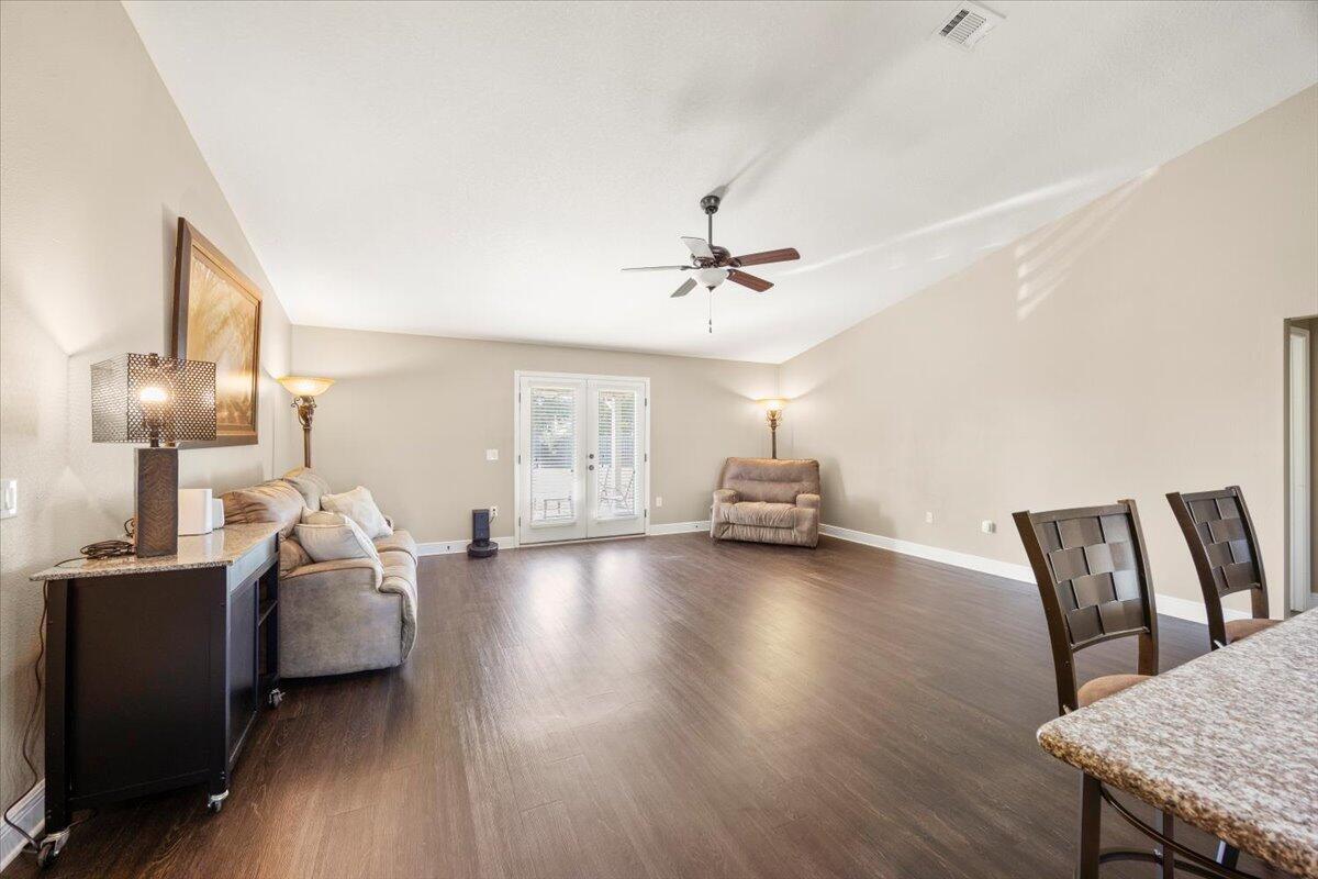 5755 Stream Mill Way Pace, FL 32571 - Photo 14 of 29 a living room with furniture and wooden floor