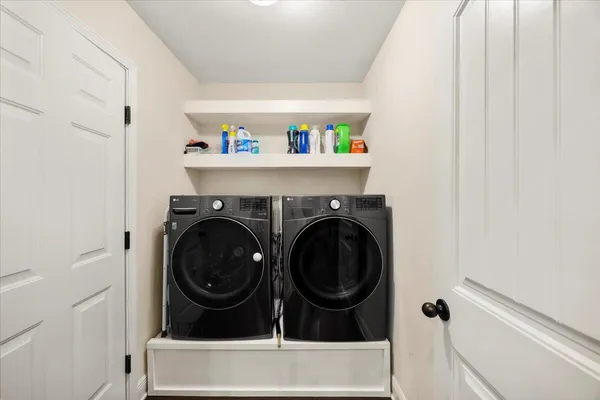 a utility room with dryer and washer