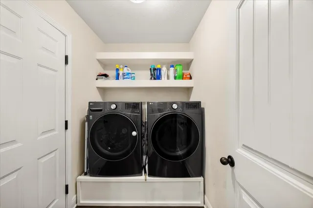 a utility room with dryer and washer