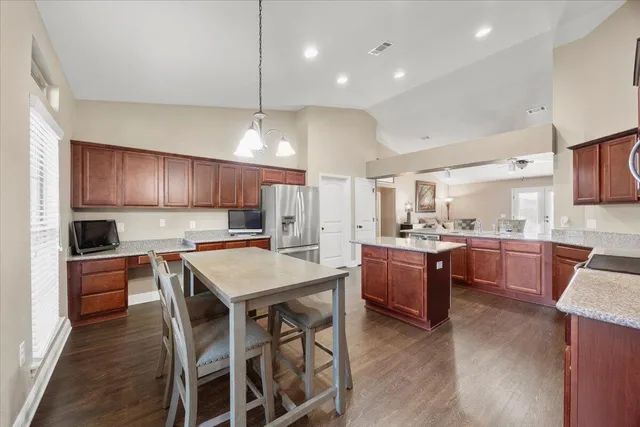 a kitchen with a table and chairs in it
