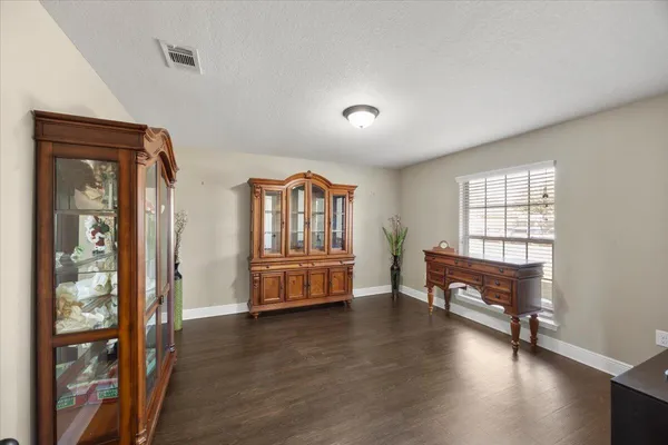 a bedroom with furniture and a window