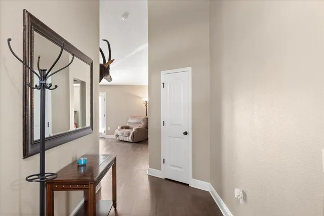 a view of living room with furniture and a window