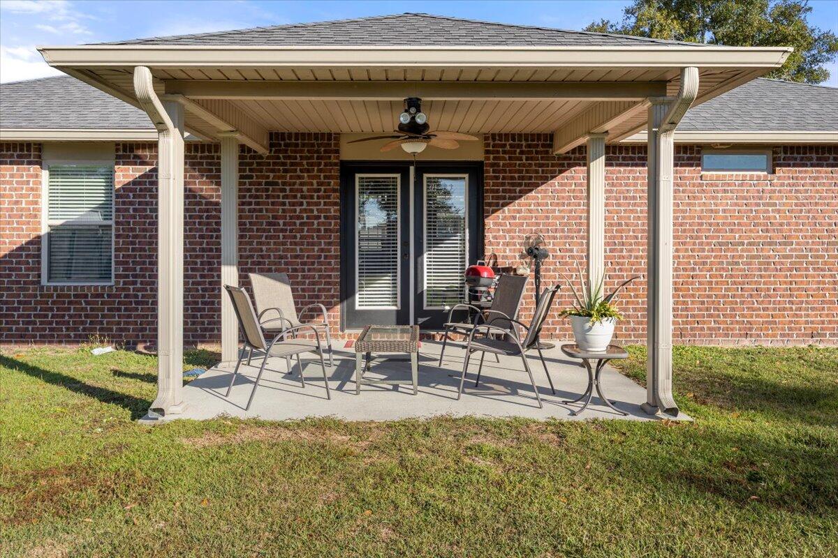 5755 Stream Mill Way Pace, FL 32571 - Photo 22 of 29 a view of two chairs in the patio