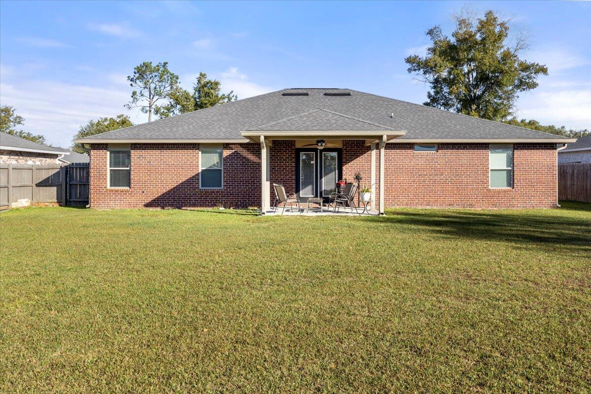 5755 Stream Mill Way Pace, FL 32571 - Photo 23 of 29 a front view of a house with a yard