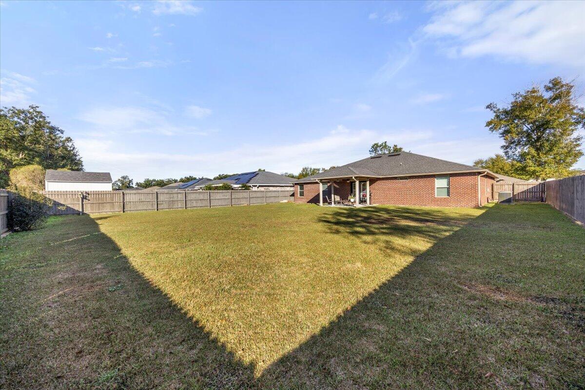 5755 Stream Mill Way Pace, FL 32571 - Photo 24 of 29 a view of a swimming pool with an ocean view
