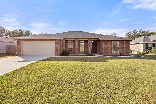 a front view of house with yard