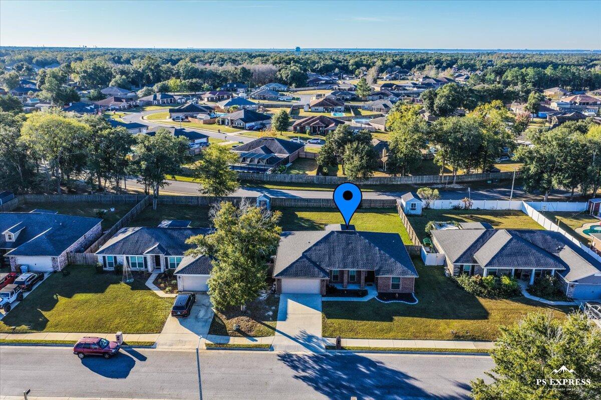 5755 Stream Mill Way Pace, FL 32571 - Photo 27 of 29 an aerial view of a swimming pool patio and outdoor seating