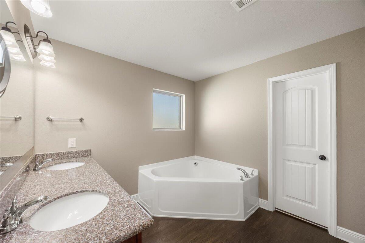 5755 Stream Mill Way Pace, FL 32571 - Photo 5 of 29 a bathroom with a granite countertop sink and mirror