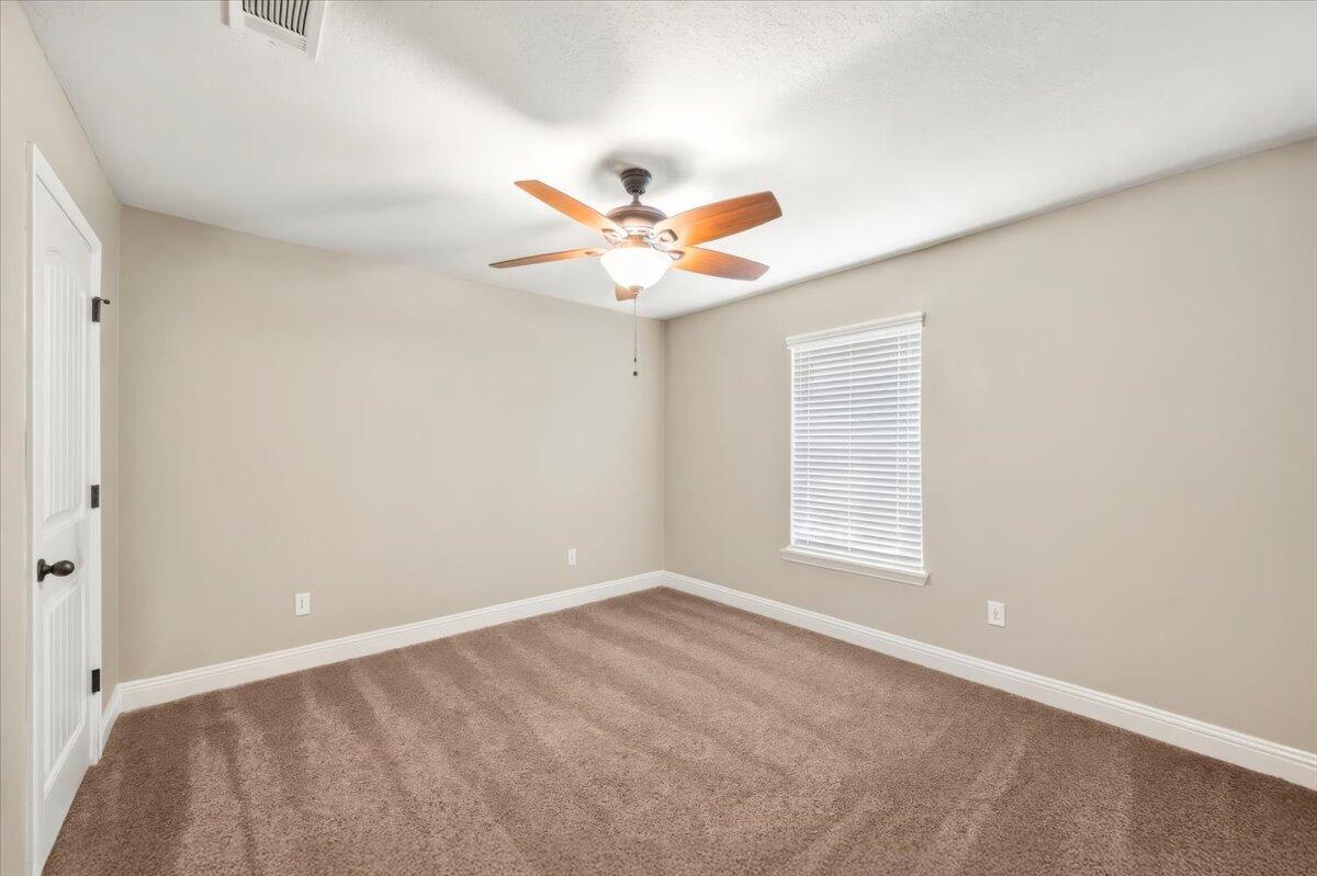 5755 Stream Mill Way Pace, FL 32571 - Photo 9 of 29 a view of an empty room with a window