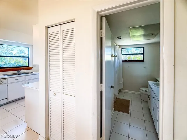 a bedroom with a bed and a tv