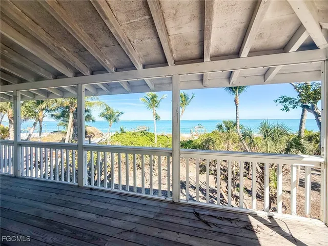a view of a balcony with wooden floor