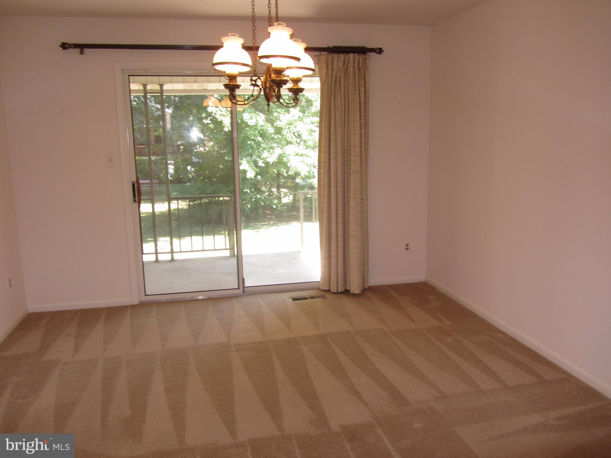 2406 Perring Woods Road Baltimore, MD 21234 - Photo 5 of 30 Dining Room with Sliders to Covered Porch