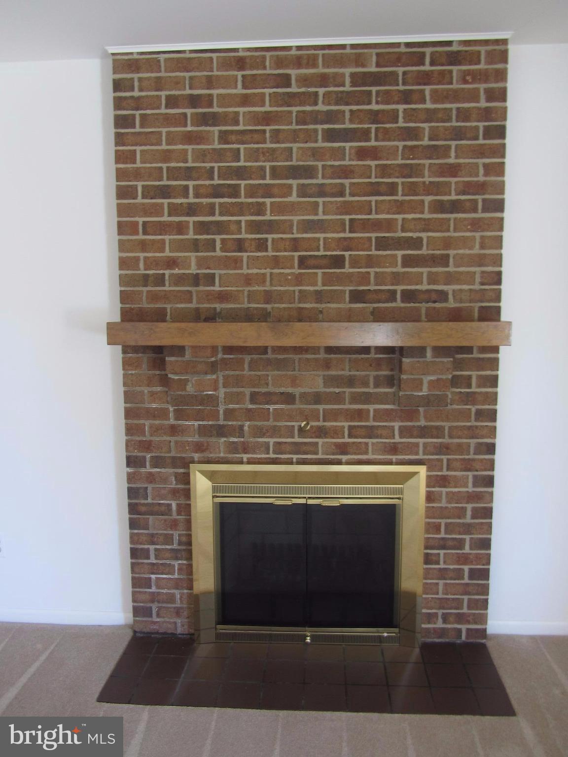 2406 Perring Woods Road Baltimore, MD 21234 - Photo 9 of 30 Living Room with Wood Burning Fireplace
