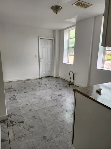 a bathroom with a toilet a sink and a bathtub