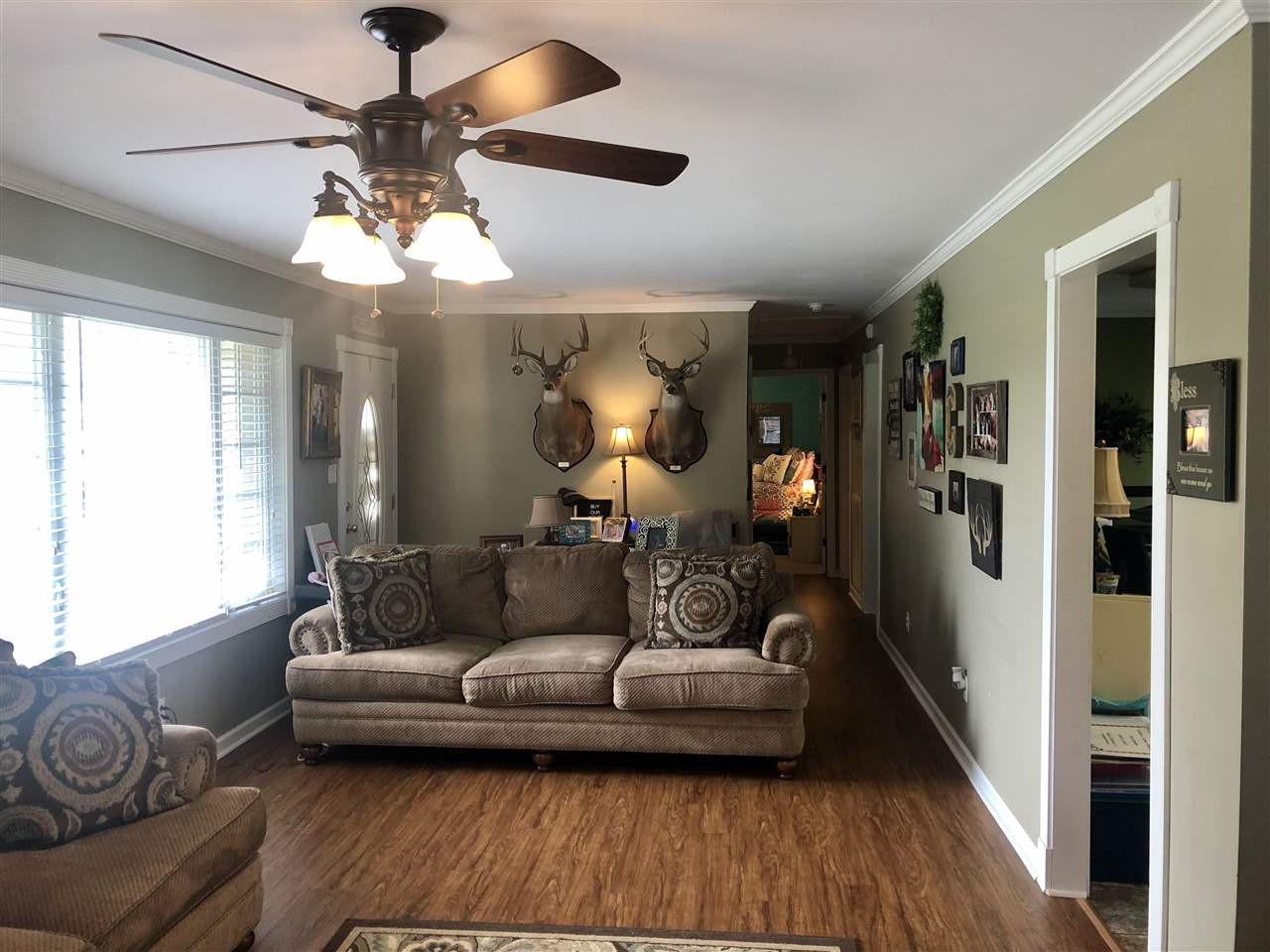 2712 Bailey Road Gadsden, TN 38337 - Photo 8 of 17 a living room with furniture and a chandelier